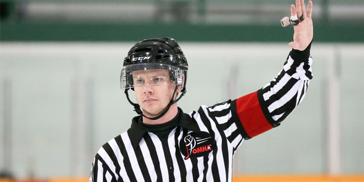Ice hockey referee making a call